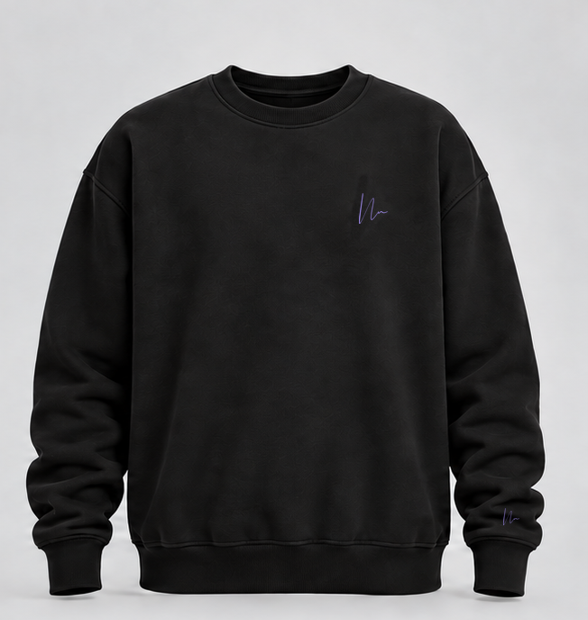 Black Double N Comfort Crewneck, exact lavender logo at left chest and small sleeve cuff logo.