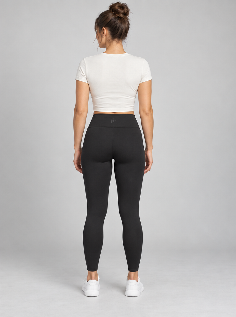 Black Luxe Crossover Leggings on a model with a small grey Double N logo at the back waistband.