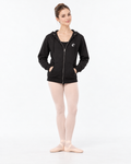 Front decoration mockup: ballet dancer wearing black Wave Dancewear fleece zip-up with small white chest Wave logo, pink tights and ballet slippers.